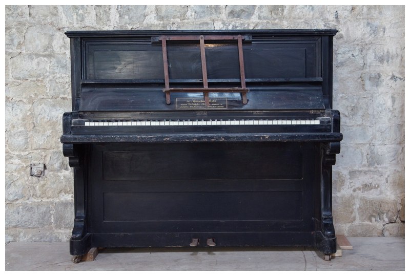 old piano inside wedding venue