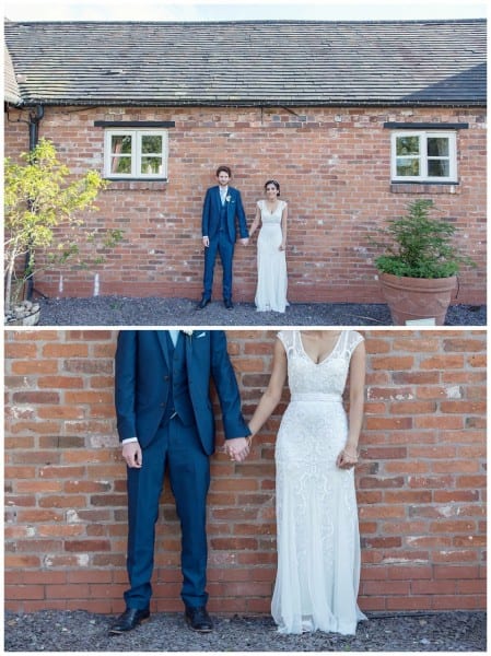 bride and groom by a wall