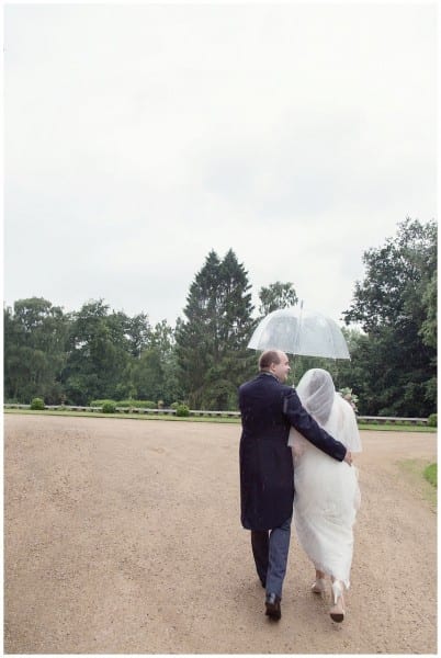 bride and groom in the rain