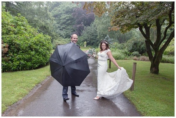 bride and groom in the rain