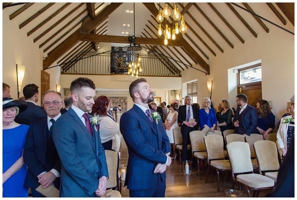 groom in ceremony room