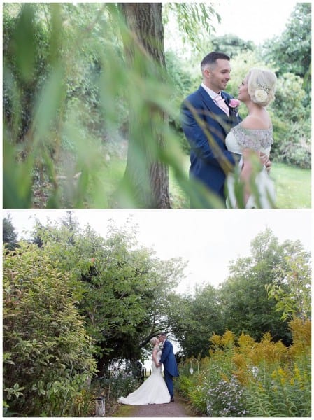 Bride and groom amongst the trees Bordesley Park Farm
