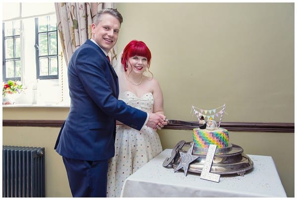 Bride and Groom cutting the cake